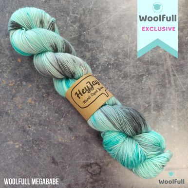 A skein of the HeyJay Woolfull Exclusive colourway in mint blue and grey.