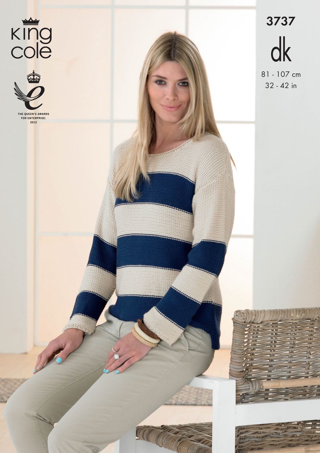 A woman is wearing a cream and navy blue striped knitted sweater.
