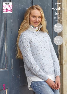 A woman is wearing a pale blue knitted sweater with cable down the sleeves.
