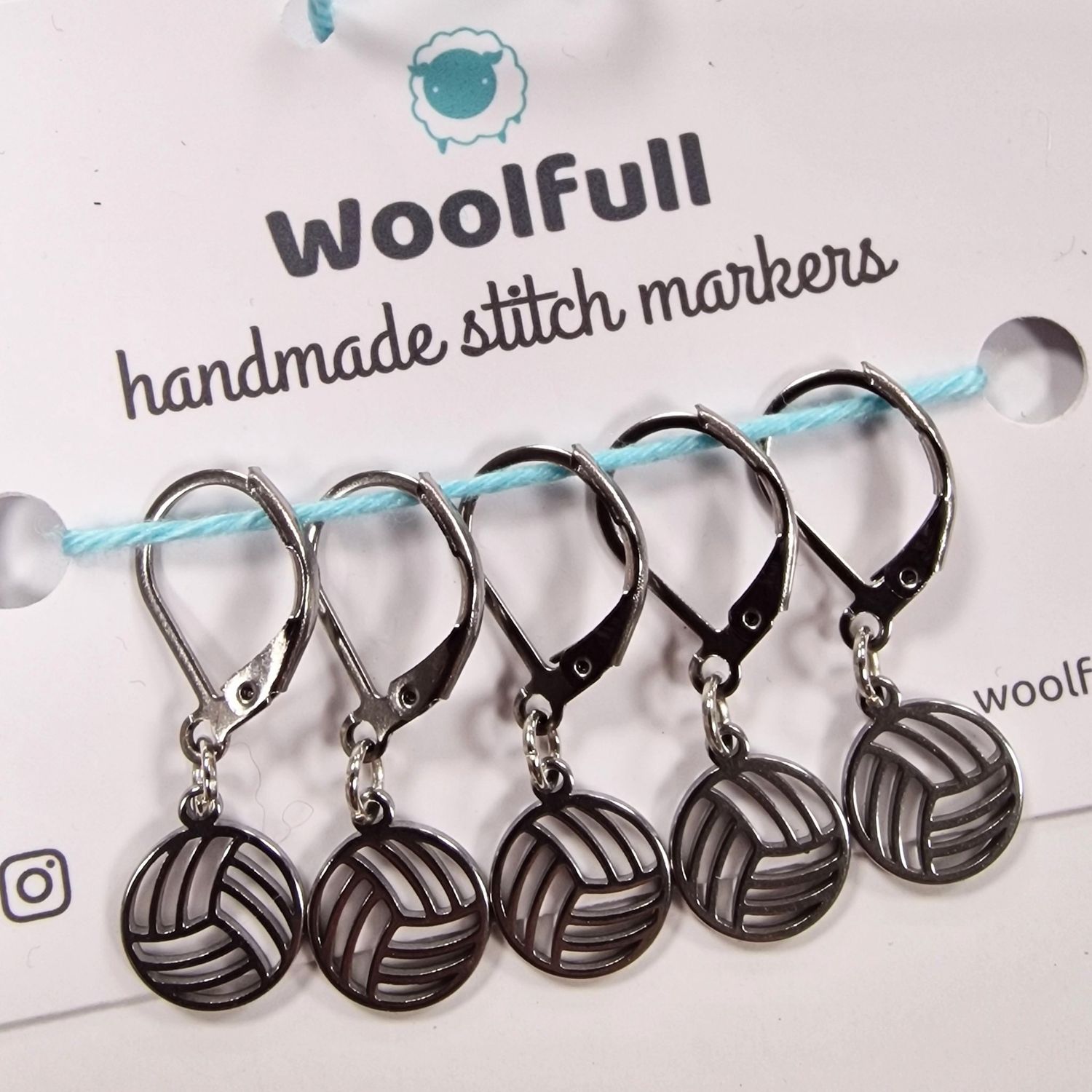 5 yarn ball shaped stitch markers.