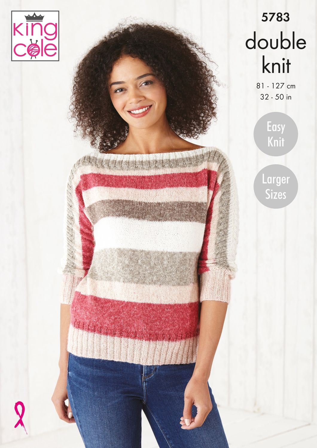 A woman is wearing a knitted top in red, cream and beige stripes.