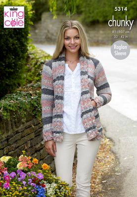 A woman is wearing a knitted jacket in a variegated pink and grey yarn.