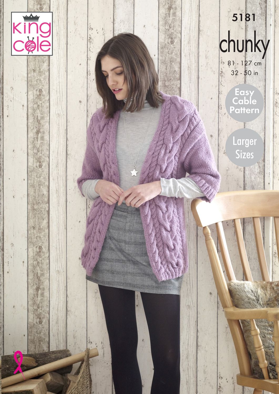 A woman is wearing a purple cable knit cardigan.