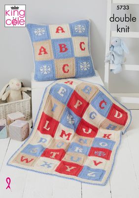 A knitted baby blanket in and matching cushion, each in red, cream, blue and beige squares, each with a letter of the alphabet knitted in each square.