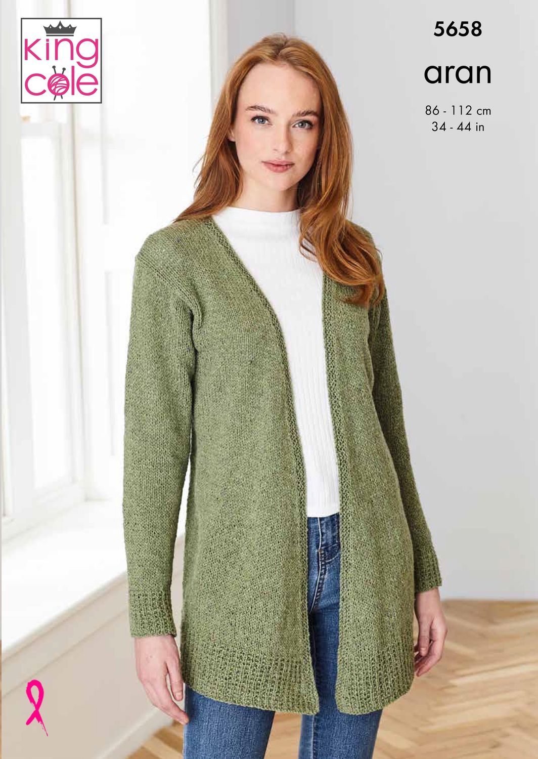 A woman is wearing a green knitted cardigan.
