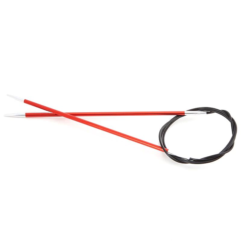 A pair of circular knitting needles with orange needle tips and a black cable.