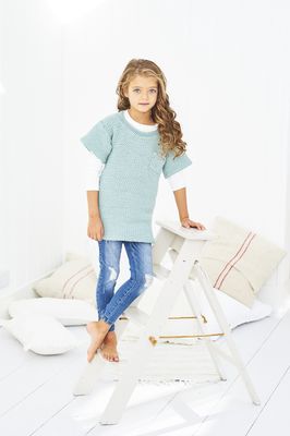 A girl is wearing a duck egg blue crocheted tunic.