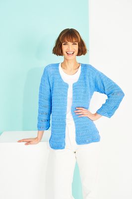 A woman is wearing a blue crocheted cardigan.