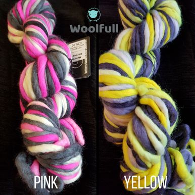 2 skeins of variegated super chunky yarn, one in grey, white and pink and the other in grey, white and yellow.