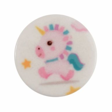 A round white button with a pale pink, blue and yellow unicorn design on it.