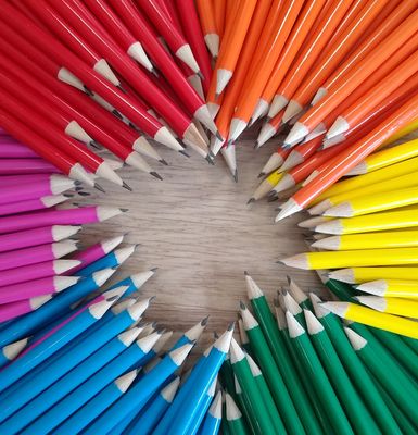 A bundle of pencils in red, orange, yellow, green, blue and pink.