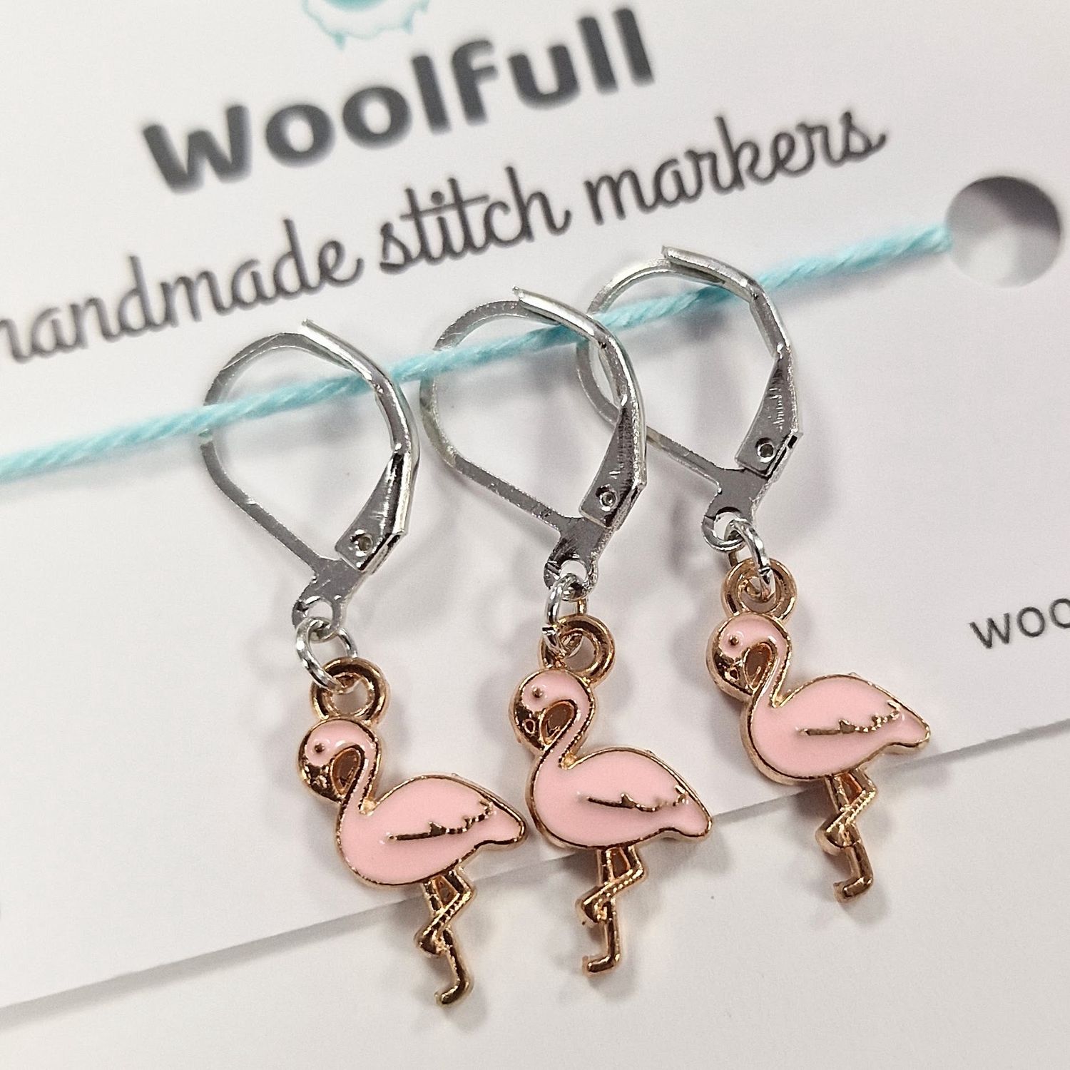 3 flamingo shaped stitch markers.