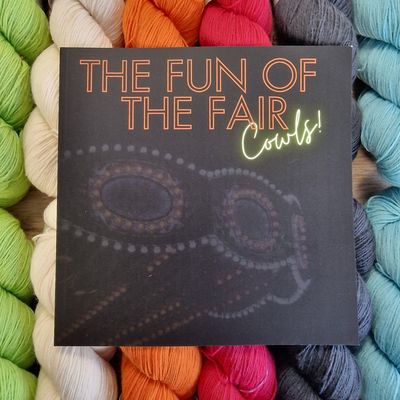 The front of the book on a background of brightly coloured skeins.
