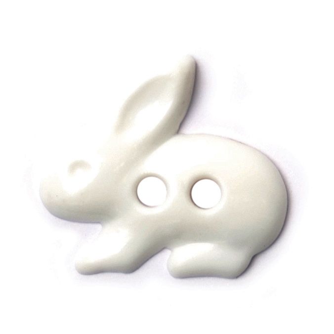 A white rabbit shaped button.