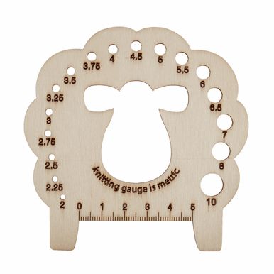 A wooden sheep shaped knitting needle gauge.