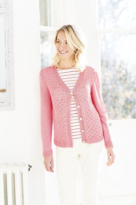 A woman is wearing a pink knitted cardigan.