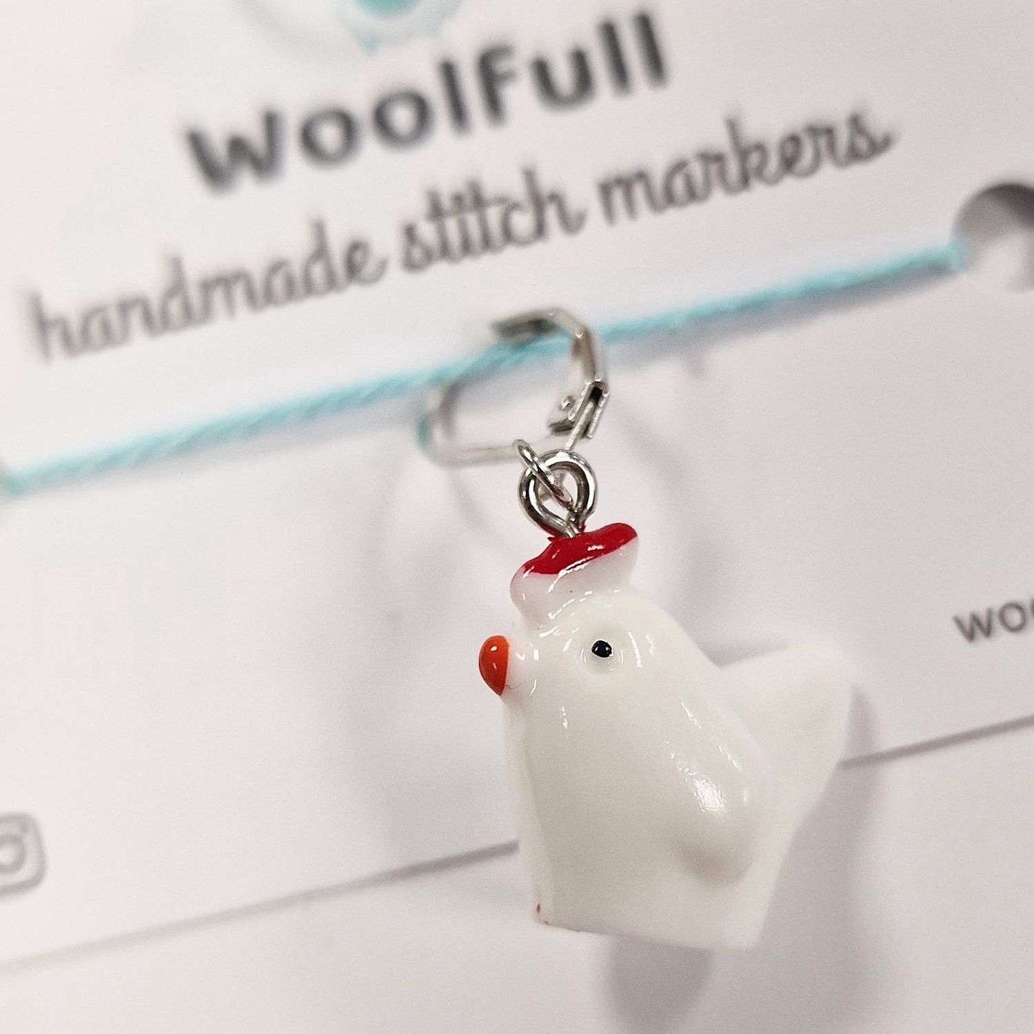 A chicken shaped stitch marker.