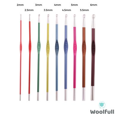 9 crochet hooks, each a different colour.