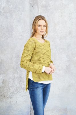 A woman is wearing a lime green crocheted sweater.