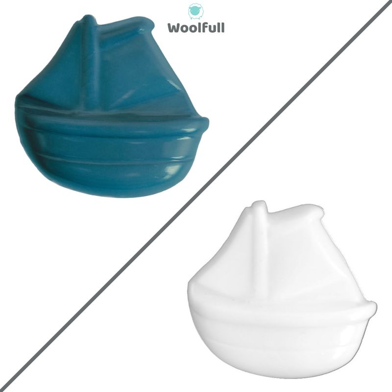 2 boat shaped buttons, 1 blue and 1 white.
