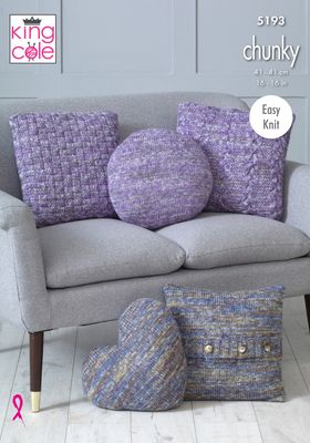 Several knitted cushions, some in a variegated purple yarn and some in a variegated blue and grey yarn.