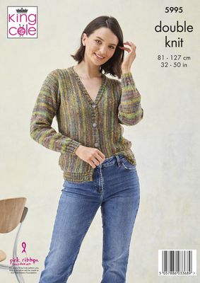 A woman is wearing a knitted cardigan in shades of red, green, purple and blue.