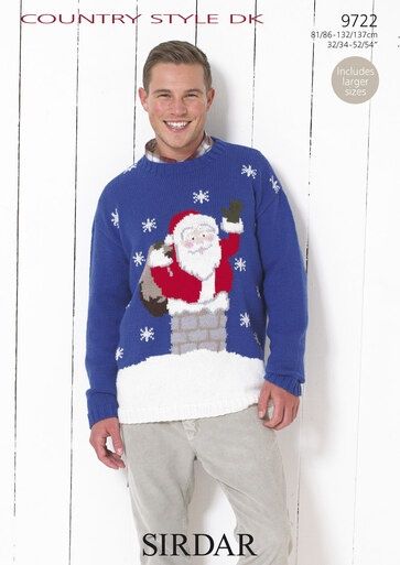 A man is wearing a blue knitted sweater with a colourwork Santa in a chimney.