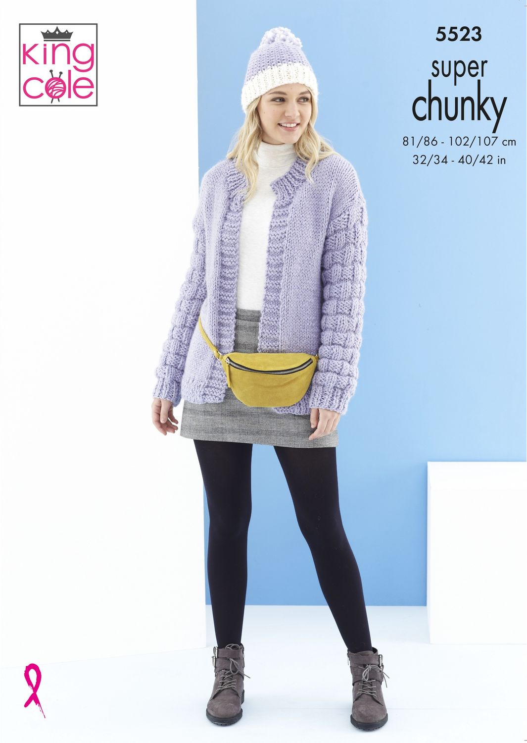 A woman is wearing a purple knitted cardigan and a purple and white knitted hat.