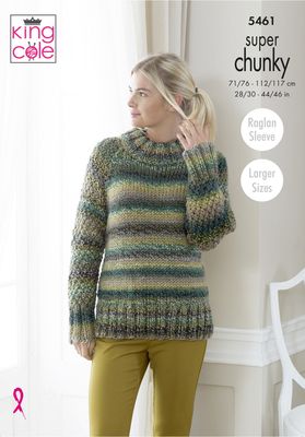 A woman is wearing a knitted sweater in a variegated green yarn.