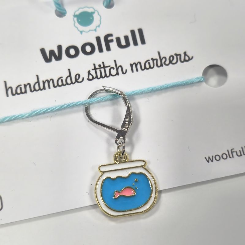 A goldfish bowl shaped stitch marker.
