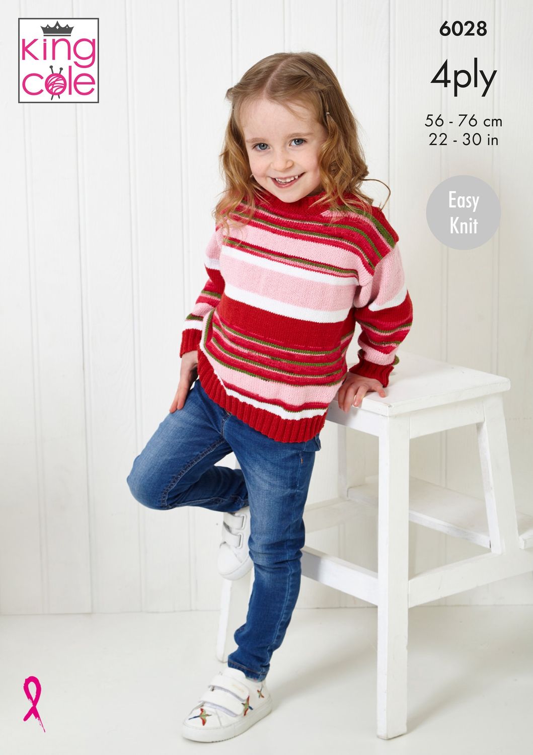 A child is wearing a sweater in shades of red and pink.