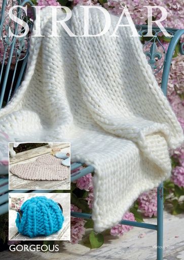 A chunky cream knitted blanket.