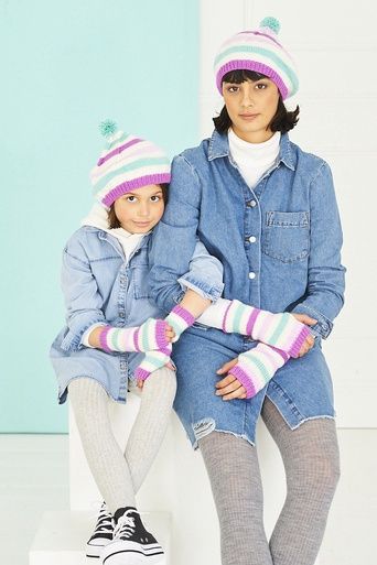 A woman and a girl are wearing matching cream, pink, purple and blue stripy knitted hats and wristwarmers.