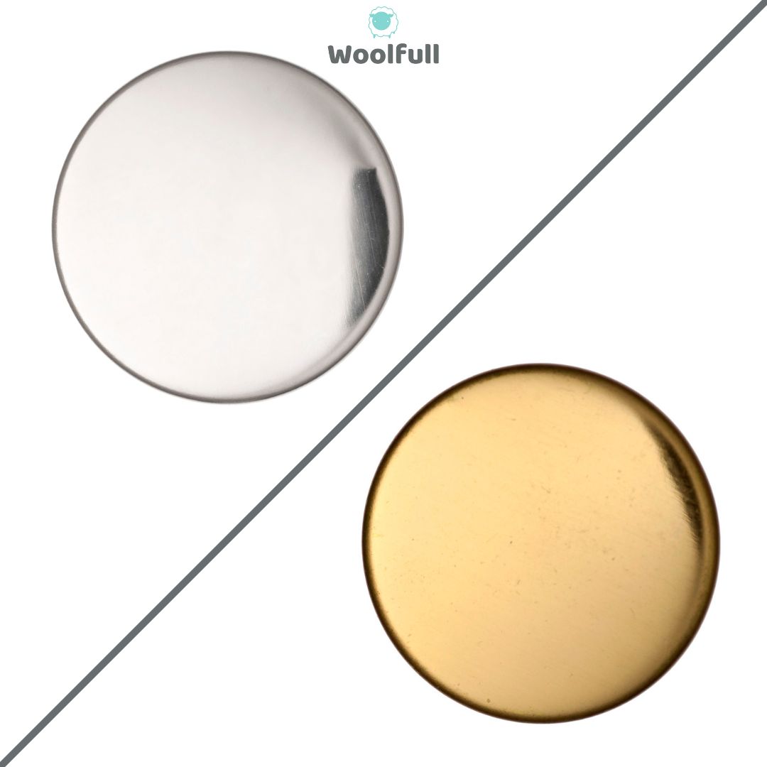 A silver metal button and a gold metal button.