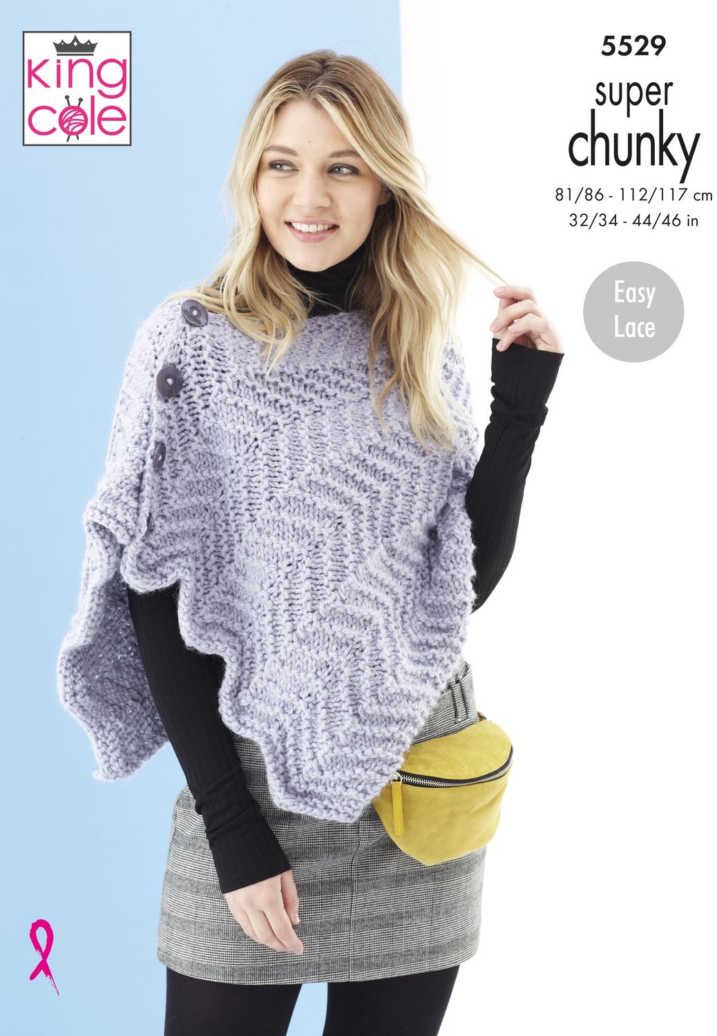 A woman is wearing a knitted poncho in silver.