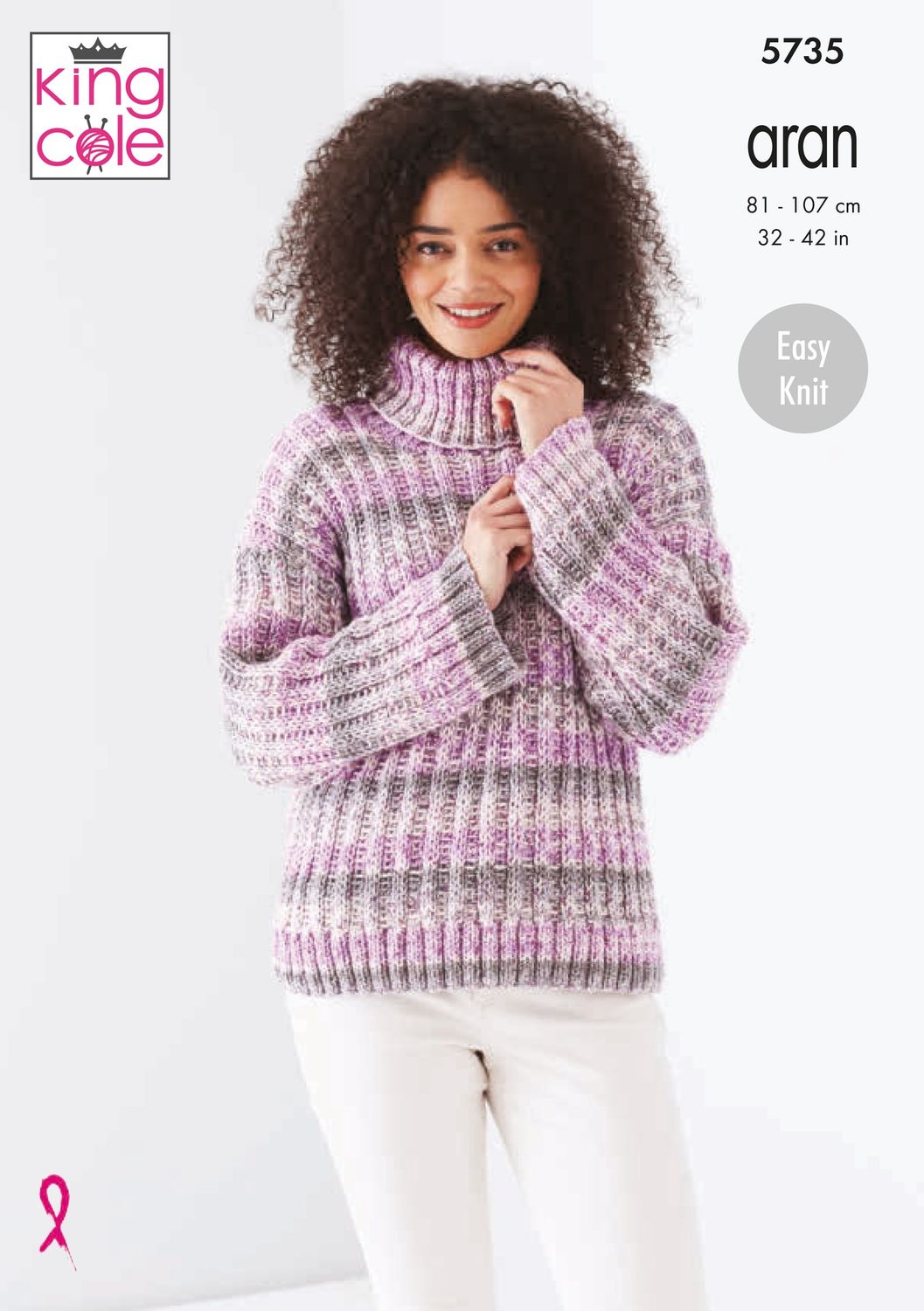 A woman is wearing a knitted rib textured sweater in a variegated pink yarn.