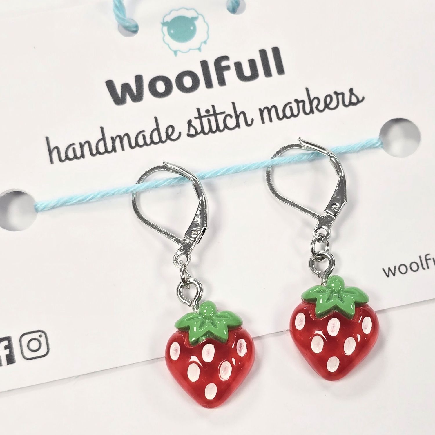 2 strawberry shaped stitch markers.