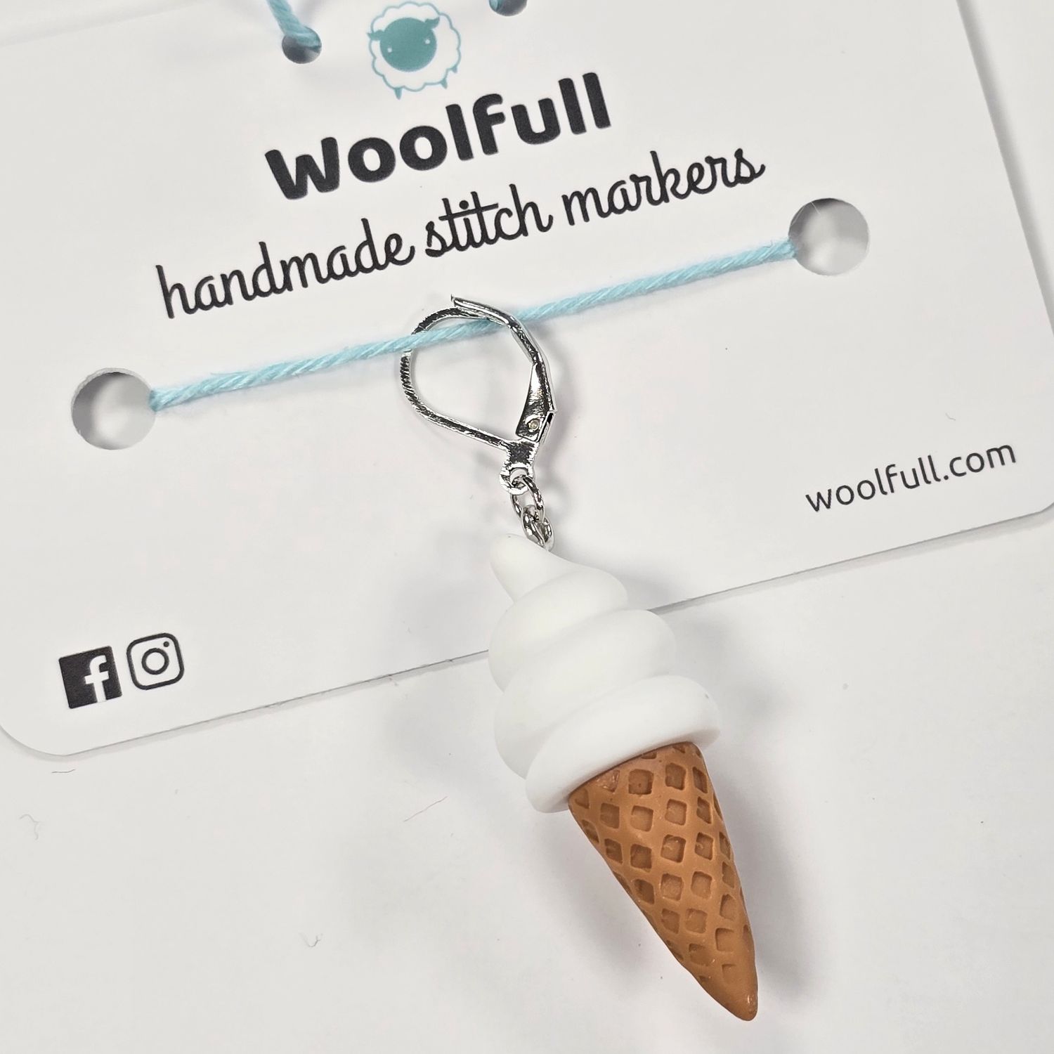 An ice cream in a cone shaped stitch marker.