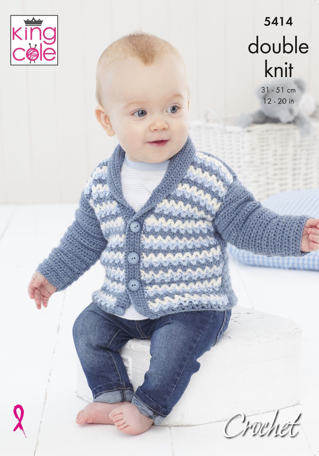 A baby is wearing a crocheted cardigan in cream, pale blue, and denim blue stripes.