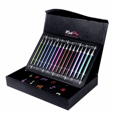 An angled photo of the open box, showing the included interchangeable needle tips.