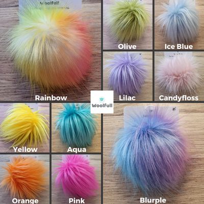 A shade card showing 10 colours of the large pompoms, in shades of yellow, blue, orange, pink, green and purple.