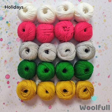 20 small balls of cotton yarn in white, red, silver, green and gold.