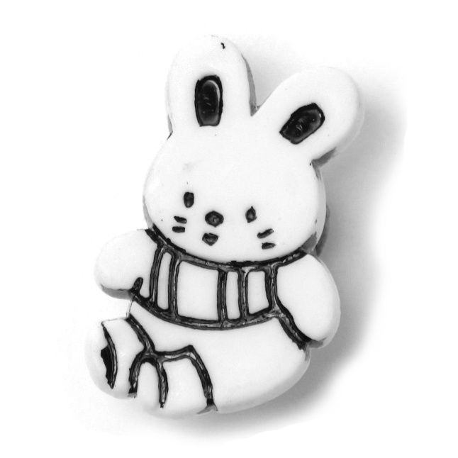 A white rabbit shaped button.