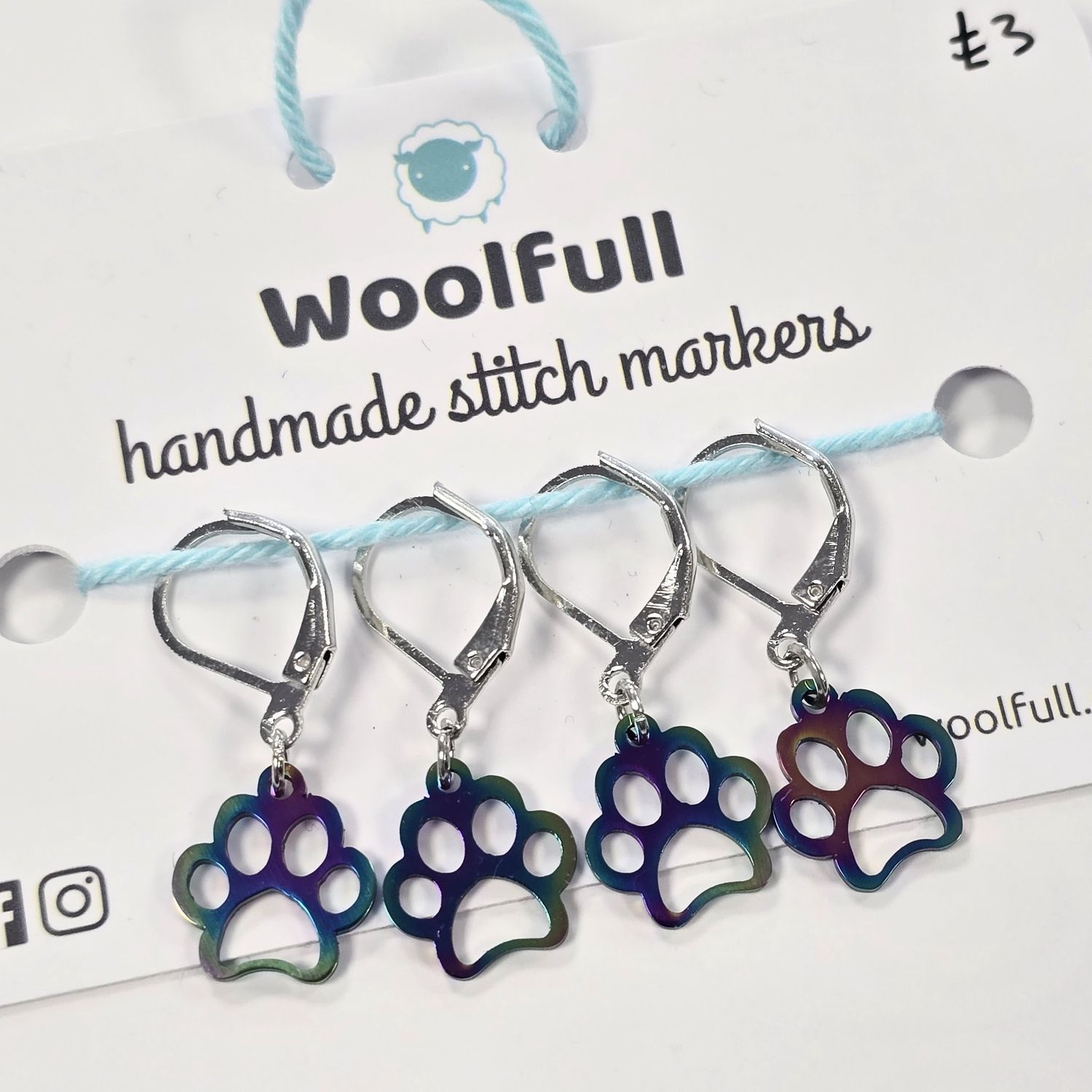 4 rainbow coloured paw shaped stitch markers.