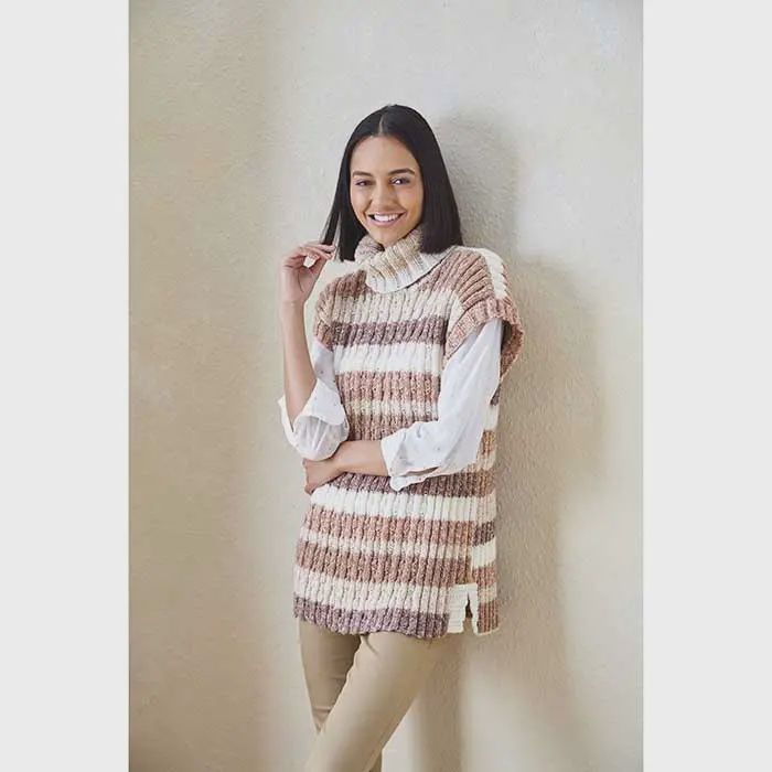A woman is wearing a knitted pullover in cream and brown stripes.