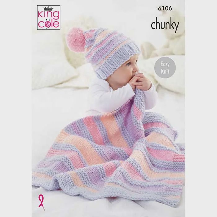 A baby is wearing a knitted hat in pink, purple and peach stripes with a matching knitted blanket.