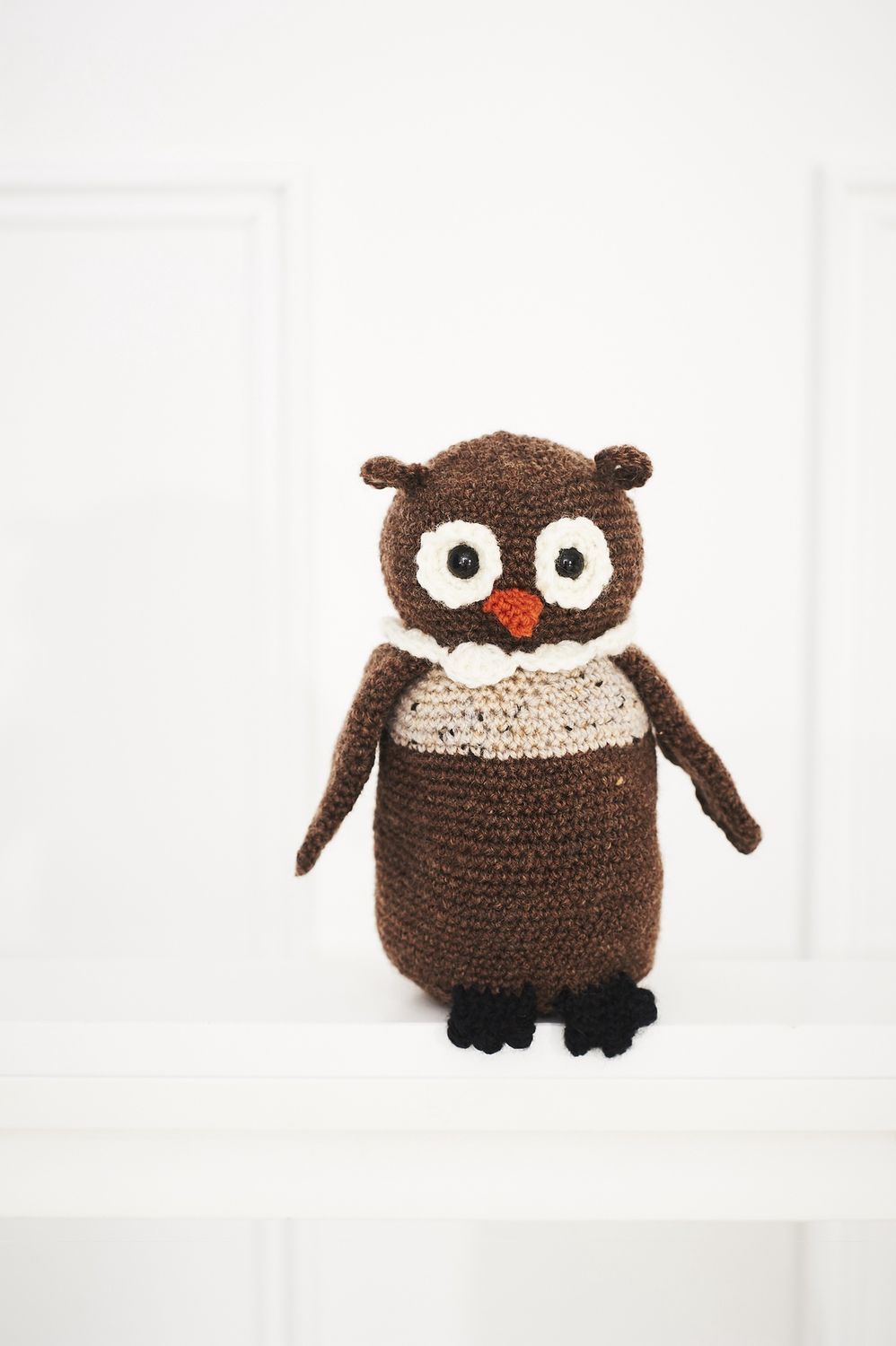 A brown crocheted owl.
