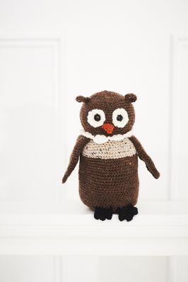 A brown crocheted owl.