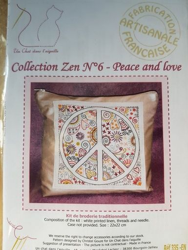 An embroidery kit for a patterned peace sign.