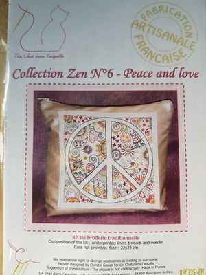 An embroidery kit for a patterned peace sign.